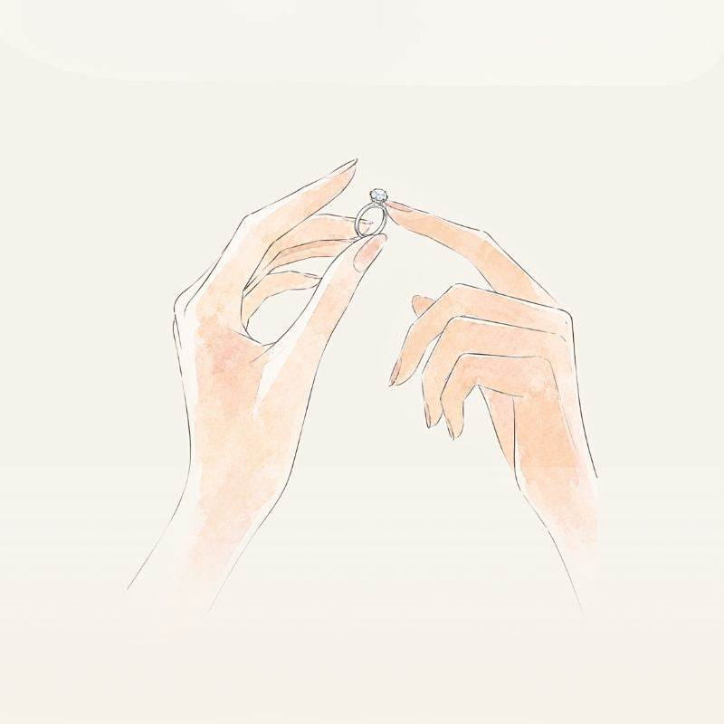 Illustration p ett par kvinnohänder som håller i en solitärring 